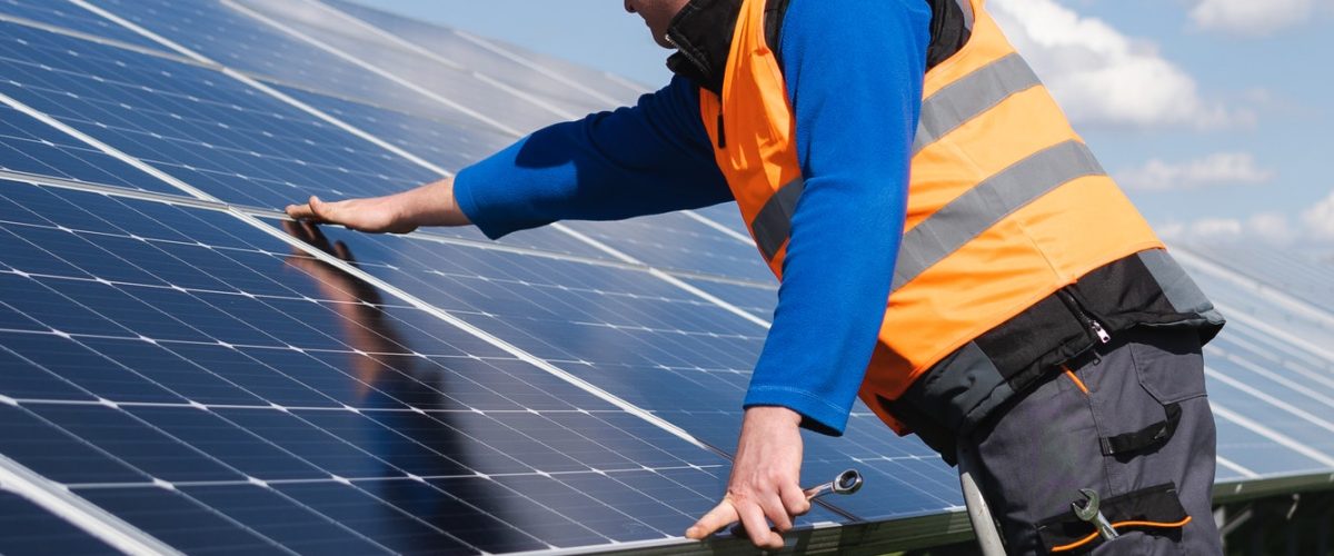 solar-power-plant-worker-on-stepladder-makes-a-visual-inspection-of-solar-panels.jpg